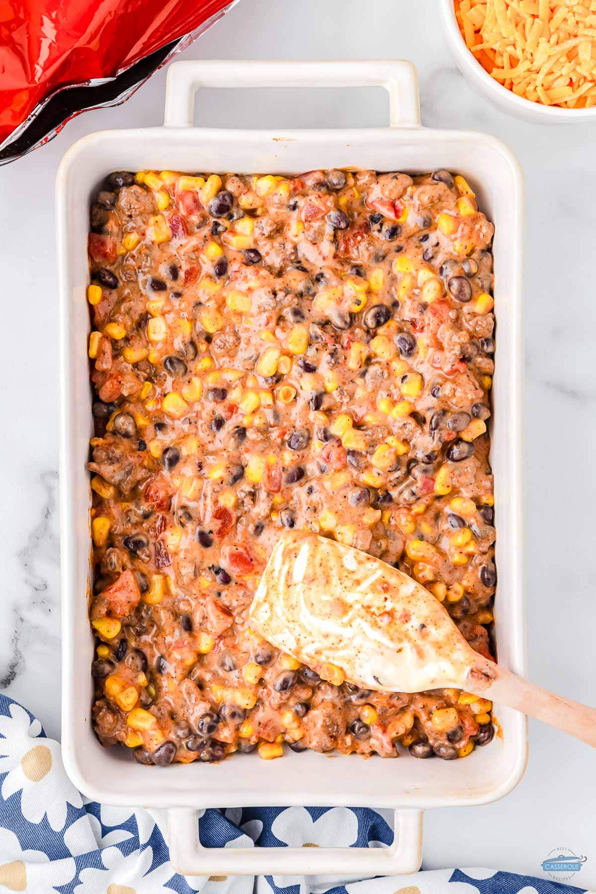 spread the mixture in a casserole dish to make a layer of meat and veggies