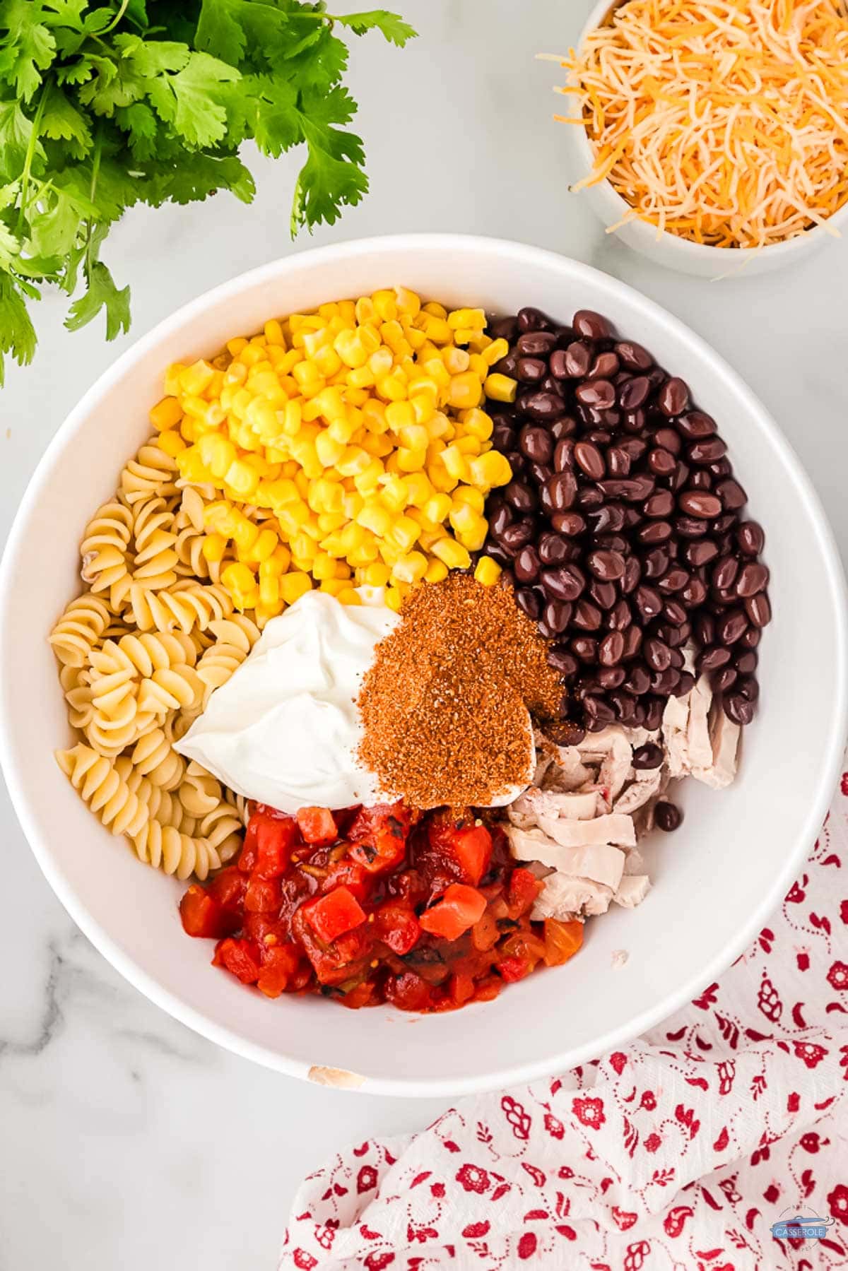 pasta, corn, and tomatoes in a bowl