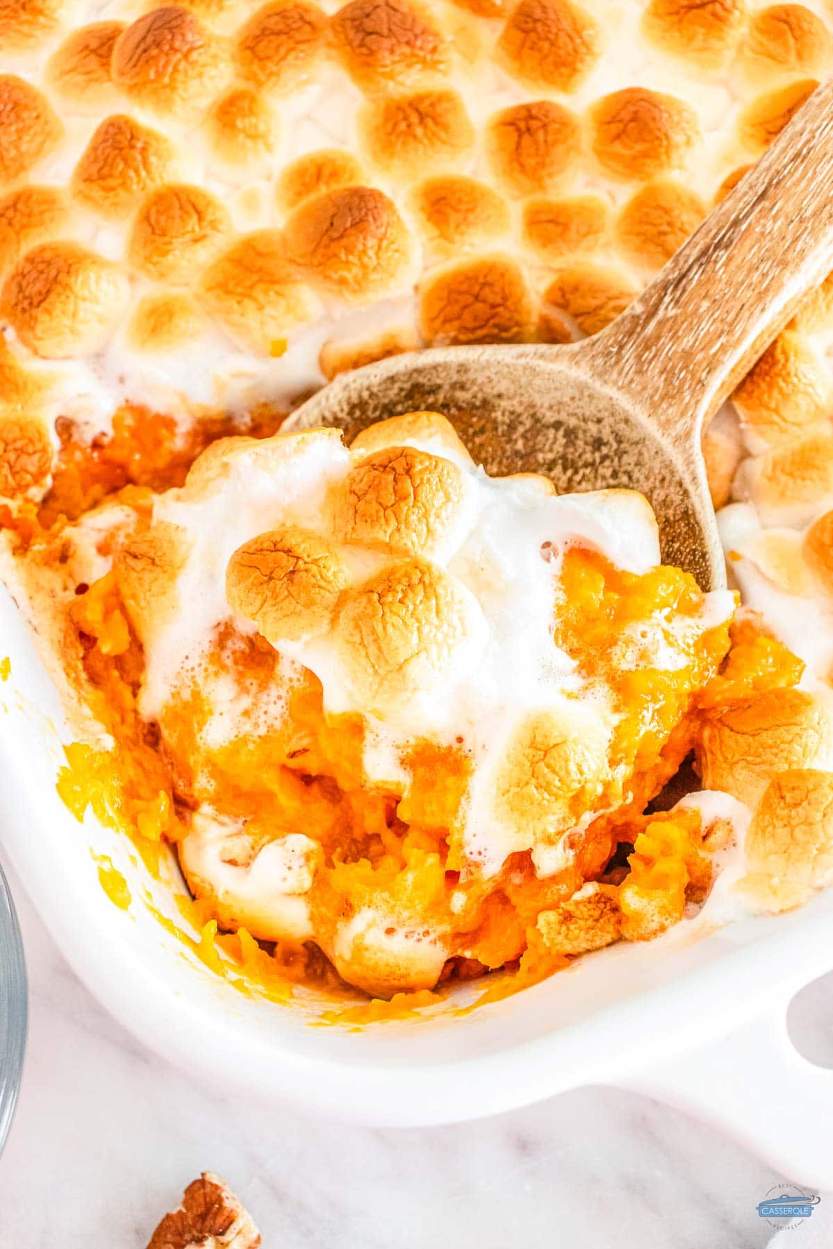 close up of sweet potato casserole in a spoon