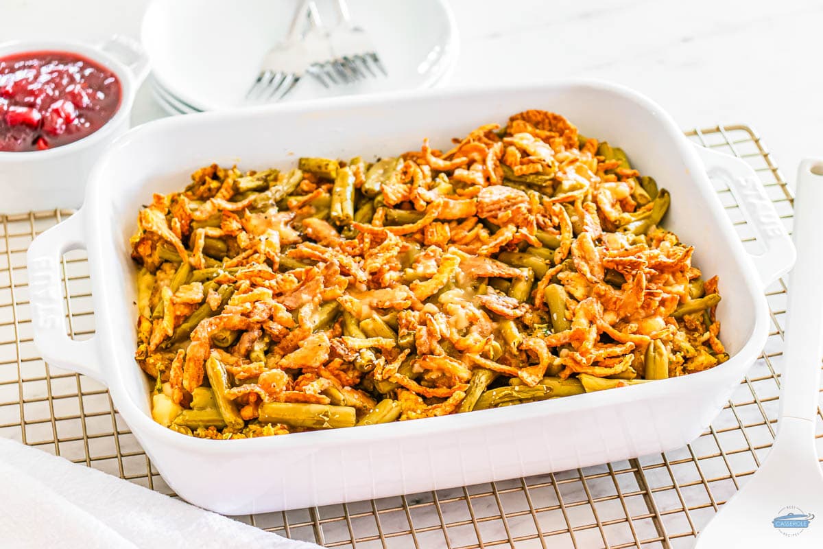 thanksgiving leftovers casserole in a white dish on a wire rack