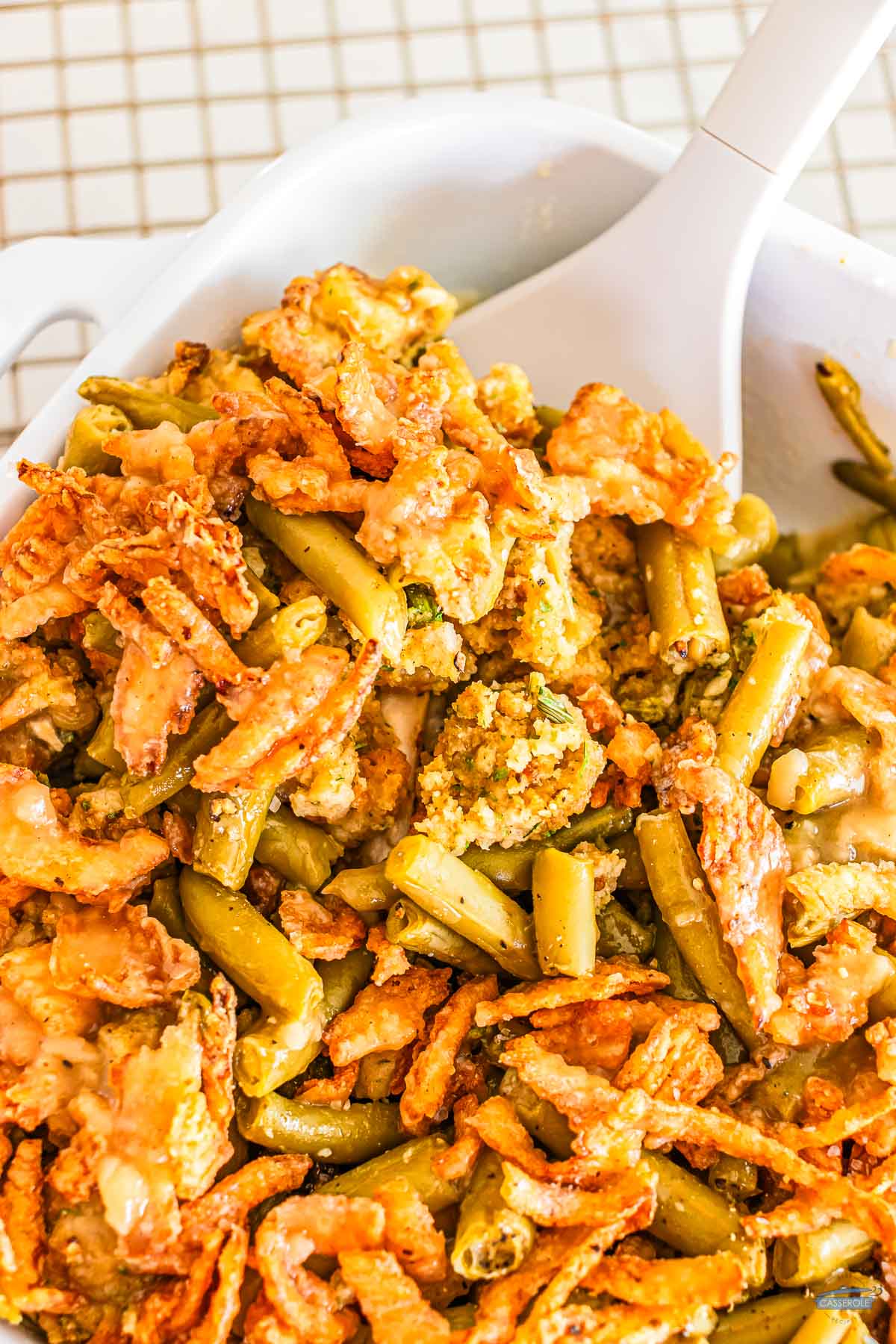 scoop of casserole with leftover green bean casserole and stuffing