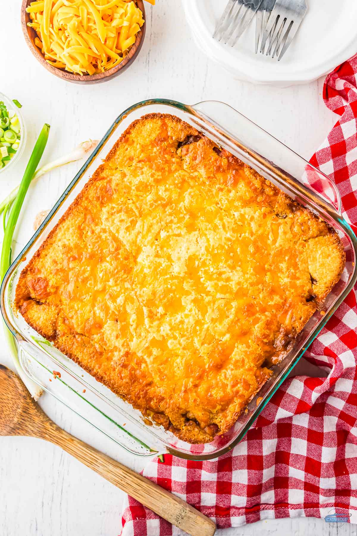 baked chili cheese dog casserole next to a red napkin